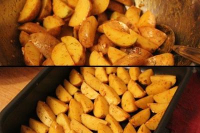 Слейте воду с картофельных долек, смешайте их с маринадом из специй и масла, дайте немного постоять. На чистый сухой противень выложите дольки кожурой вниз и уберите в разогретую до 200 градусов духовку на 20-30 минут.
