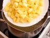 Когда курица сварится, добавьте в бульон картофель (а лук достаньте и выбросите). Варите 20 минут.